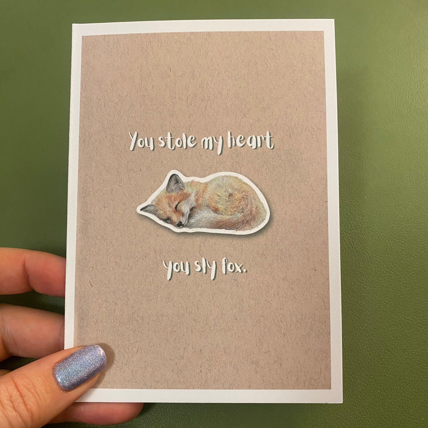 cute pun ainimal greetings card with sleeping fox cub saying "you stole my heart you sly fox" for Valentine's day