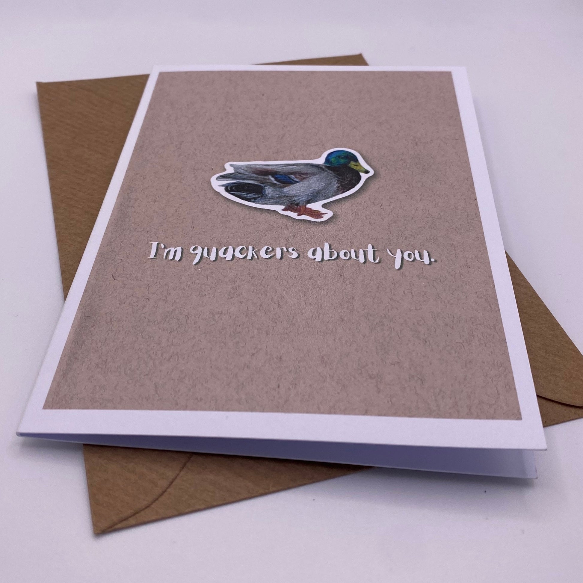 cute pun ainimal greetings card with duck saying "I'm quackers about you" for Valentine's day