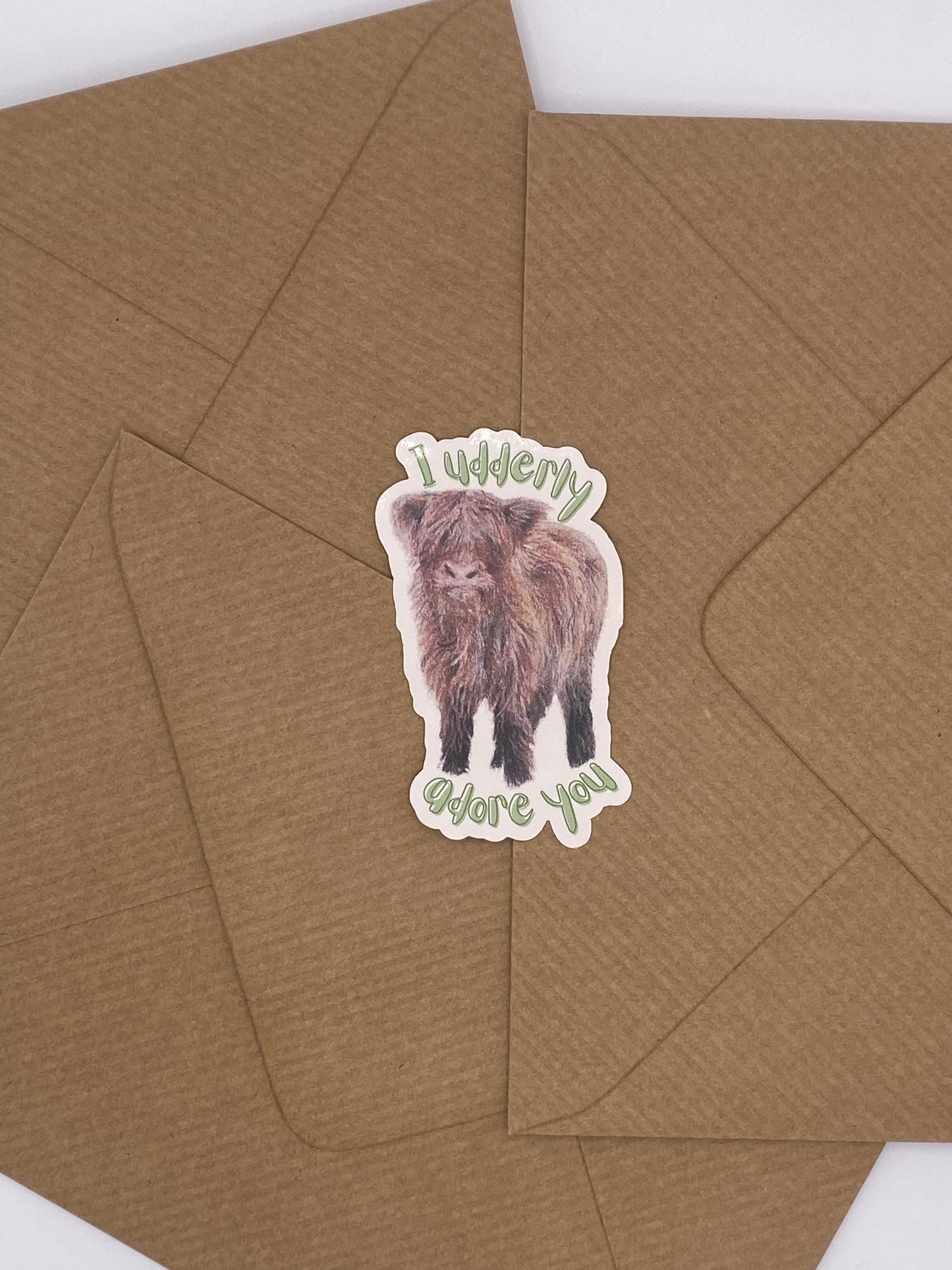 cute hand-drawn highland cow calf sticker with Valentine's pun. 