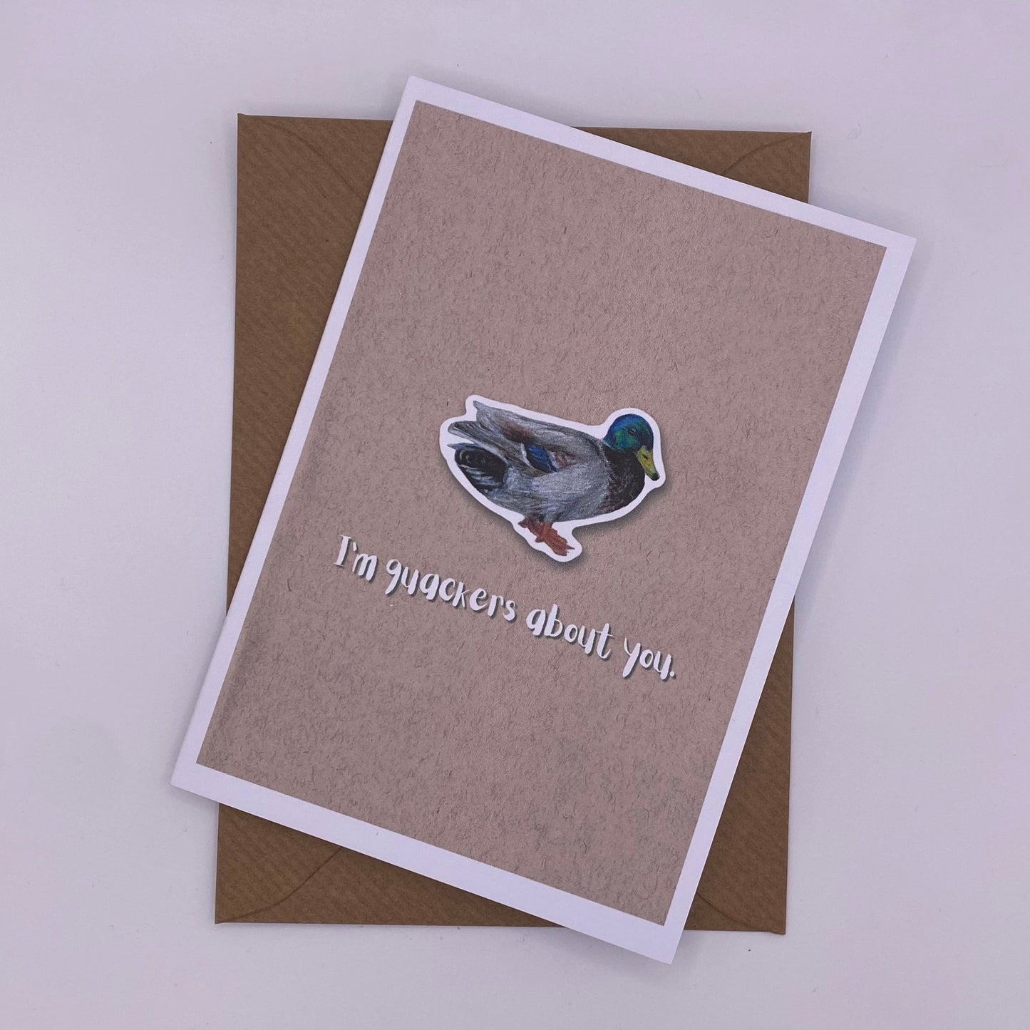 cute pun ainimal greetings card with duck saying "I'm quackers about you" for Valentine's day