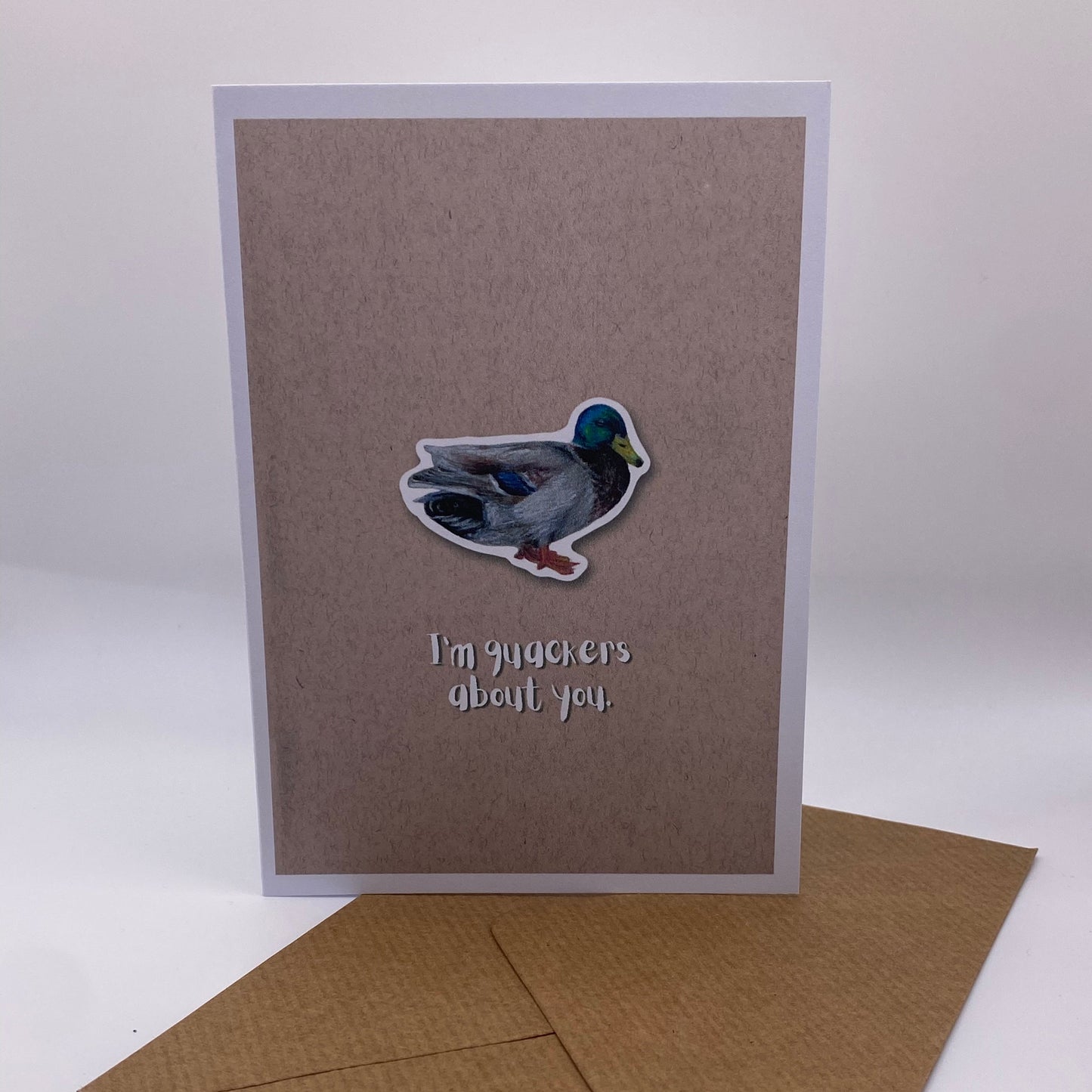 cute pun ainimal greetings card with duck saying "I'm quackers about you" for Valentine's day