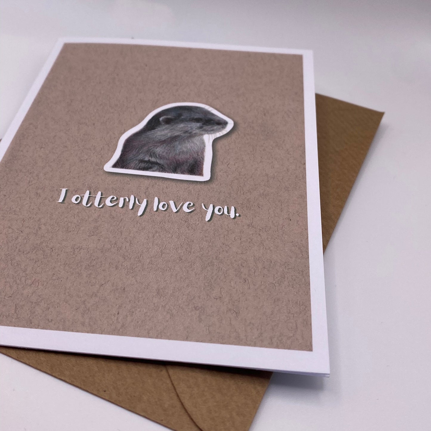 cute pun ainimal greetings card with otter saying "I otterly love you" for Valentine's day