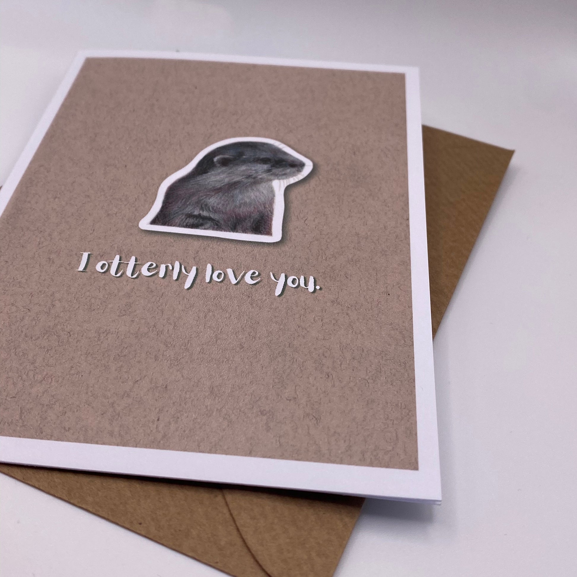 cute pun ainimal greetings card with otter saying "I otterly love you" for Valentine's day
